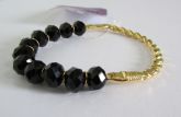 Pulseira cristais preto e detalhe dourado